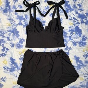 black two piece tankini set with swim skirt and bow shoulder details, size L